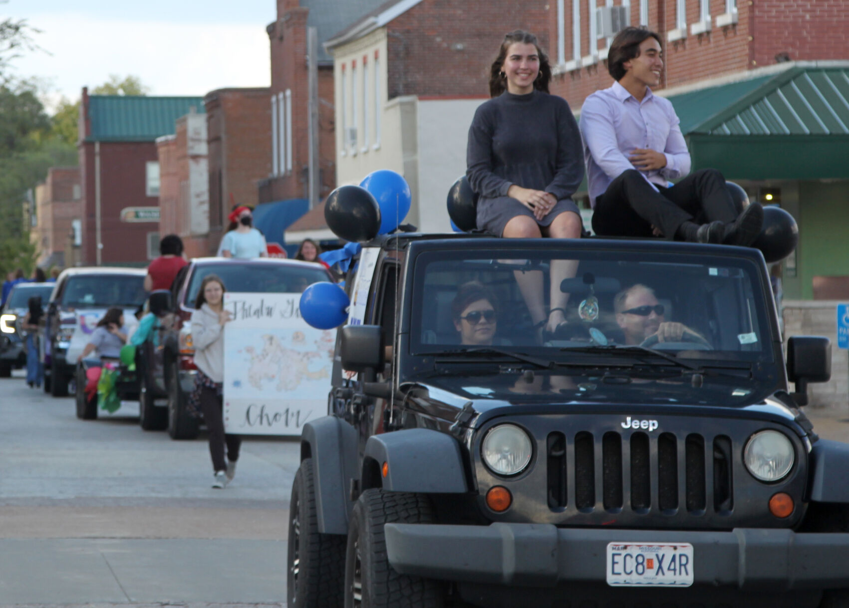 Kaylee Karll and Owen Burge ride in parade